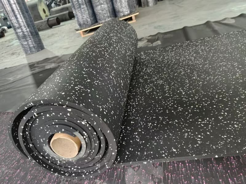 A technical graphic illustrating the compression of rubber granules to increase density